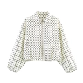 Detailed view of white jacket featuring black polka dot print and silver metal zipper closure - White Polka Dot