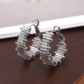 Modern silver-toned hoop earrings with a geometric layered texture design for women - Geometric Stacked Hoop