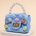 Sky blue quilted jelly crossbody bag for kids with cartoon charms and pearl handle - Sky Blue