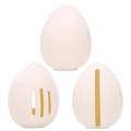 Three light pink silicone beauty sponge holders with various breathable hollow cutouts - Egg Shape Sponge Case / Cream