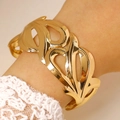 Detailed close-up of wide hollow gold geometric bangle with irregular leaf pattern - Wavy Leaf Hollow Wide Bangle (8153) / Gold