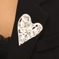 Silver liquid metal heart brooch with hammered texture on a black suit lapel - Hammered Heart Silver Style (16 Steel Color 1521)