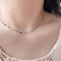 Elegant 18K gold plated titanium necklace with blue and white beads on model neck - Blue Gradient (H197) Gold