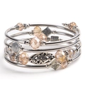 Detailed view of pink zebra stone multi-layer wrap bracelet with carved floral charms - Champagne Crystal
