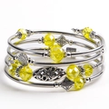 Detail of multi-layered stone bracelet with yellow crystal beads and floral metal charms - Light Yellow Citrine