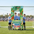 Outdoor 2026 World Cup photo booth banner with soccer flags and trophy on green field - 180x90cm