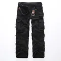 Men's loose fit black cargo pants with multiple pockets and a woven belt for outdoors - EU 28 / Black
