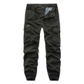 Detail of dark olive cargo pants featuring elastic drawstring waist and side flap pockets - Dark Green