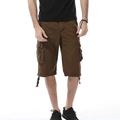 Macro detail of men's dark brown cargo shorts showing durable cotton fabric and large side pockets - Coffee