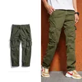 Detail view of military green multi-pocket cargo pants with durable side flap pockets - EU 29 / Dark Army Green