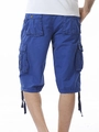 Detail of dark blue cargo shorts showing back pockets and durable cotton canvas fabric - Blue