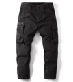 Detail view of dark cargo pants featuring large button flap pockets and metal zipper detail - EU 29 / Black