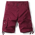 Detailed view of burgundy cargo shorts featuring functional side flap pockets and hem drawstrings - EU 30 / Burgundy
