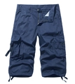 Detail of dark blue cargo shorts showing large flap pockets and hem drawstring adjustments - Blue