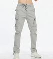 Detail of light gray cargo pants featuring a drawstring waist and multi-pocket design - EU 29 / Light Gray