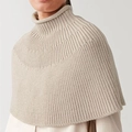 Detailed close-up of ribbed knit texture on oatmeal high-neck sleeveless shawl wrap - S / Beige