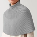 Detail of grey high-neck knit poncho showing fine vertical ribbed texture and minimalist style - S / Light Gray
