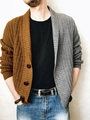 Detail of two-tone knit cardigan with cable textures and large buttons on men sweater - S / Brown