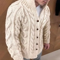 Close-up of beige heavy-knit men's cardigan featuring intricate cable knit and large buttons - M / Off White