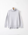 Vista dettagliata della trama a costine sull'orlo e sui polsini di questo maglione in maglia - S / Grigio chiaro