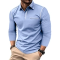 Detail of light blue long-sleeved polo shirt showing contrast stitching and chest pocket - Blue