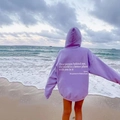 Detail of lavender fleece hoodie featuring a heart-warming quote print on the back - Purple