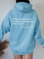 Back view of light blue oversized fleece hoodie featuring white typography and ribbed cuffs - Sky Blue