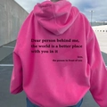 Detail of hot pink hoodie back featuring black artistic typography and drop shoulder - XS / Tops / Rose Red - Black Print