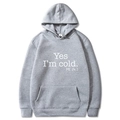 Grey long-sleeve hoodie featuring white Yes I'm Cold text print and kangaroo pocket - S / Light Gray with White Print