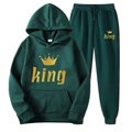 Detailed macro view of King crown print and size label on fleece hoodie set - S / KING / Dark Green