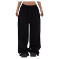 Detail of high waisted black wide leg trousers featuring an elastic waistband and soft cotton fabric - Black