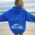 Sweat à capuche oversize bleu roi avec imprimé océan tropical et texte Life Comes in Waves - S / Bleu