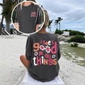 Détail de l'imprimé tournesol sur le t-shirt gris foncé surdimensionné pour femmes - S / Gris foncé