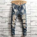 Distressed vintage washed denim jeans for men featuring retro rips and plaid waist lining - EU 28 / Vintage Blue