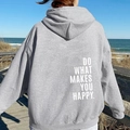 Oversized grey hoodie with Do What Makes You Happy back print on a sunny beach - Light Gray (White Logo)