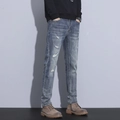 Jeans da uomo slim fit blu con strappi sulle ginocchia e texture baffata trendy - EU 28 / Blu Medio (SY6533#)