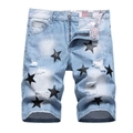 Men's light blue ripped denim shorts with black leather star patches and distressed details - EU 28 / Light Blue
