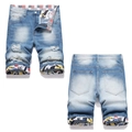 Men's light blue distressed denim shorts with graffiti print cuffs and ripped details - EU 38 / Light Blue