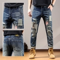 Slim-fit vintage herenjeans in blauw met zwaar borduursel en patchwork details - EU 28 / Donkerblauw