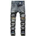 Men's retro washed blue denim jeans with distressed knee holes and slim fit street style - EU 32 / Indigo