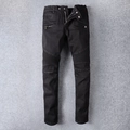 Détail d'un jean biker noir montrant les genoux plissés et les poches zippées en métal - EU 28 / Noir