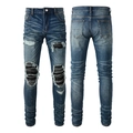 Detail of distressed blue jeans with black pleated patchwork inserts and heavy ripping - Medium Blue Washed Distressed Style(6612)