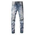 Dettaglio jeans uomo slim fit blu con toppe a stella e strappi sulle ginocchia - EU 28 / Azzurro