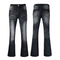Detail view of faded black flare jeans with paint splatter and vintage wash texture - 63629 / EU 28