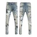 Detail of light blue washed slim jeans featuring white and black graffiti print accents - EU 28 / Light Blue Brand Graffiti Style