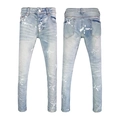 Detail of light blue washed slim fit jeans featuring white paint splatters and graphics - EU 28 / Light Blue Brand Graffiti Style
