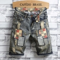 Details von Vintage-Jeans-Shorts mit Destroyed-Effekten und Stern-Muster-Patches - EU 28 / Blau (773)