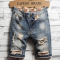 Men's distressed denim shorts in mid-blue wash with ripped details and rolled cuffs - EU 28 / Medium Blue Washed Heavy Ripped Patchwork (789)