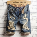 Detail von Denim-Shorts mit民族风-Print-Futter und markanten Destroyed-Effekten - EU 28 / Blau (780)