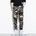 Detail of cargo pants showing camo pattern with functional flap pockets and jogger cuffs - M / Khaki Camouflage